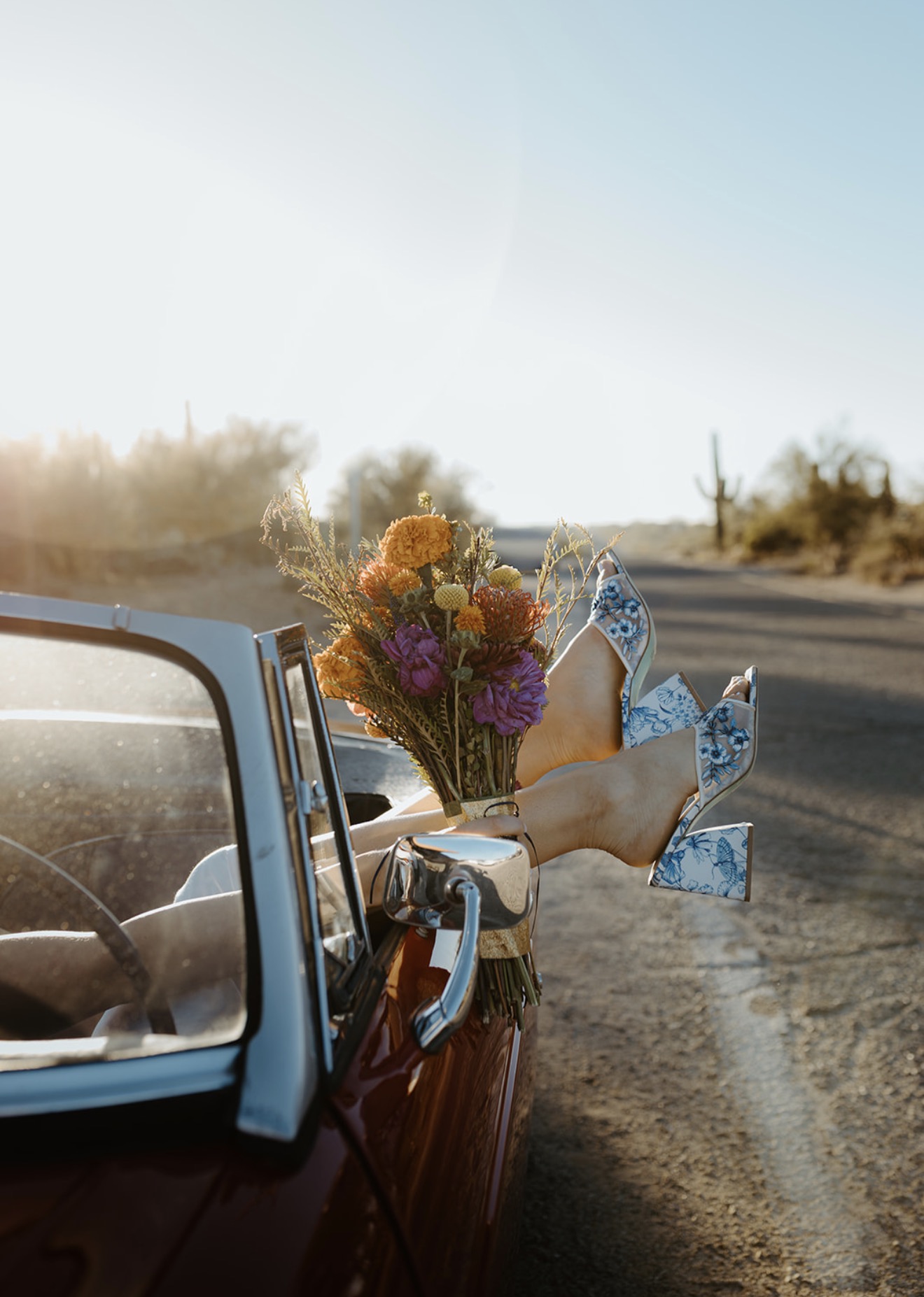 Wedding bouquet and shoes photographed in the maroon MG